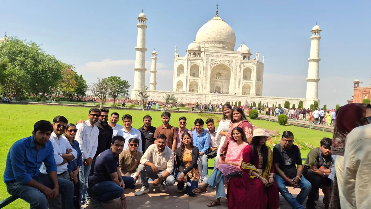 Team photo with Taj Mahal background
